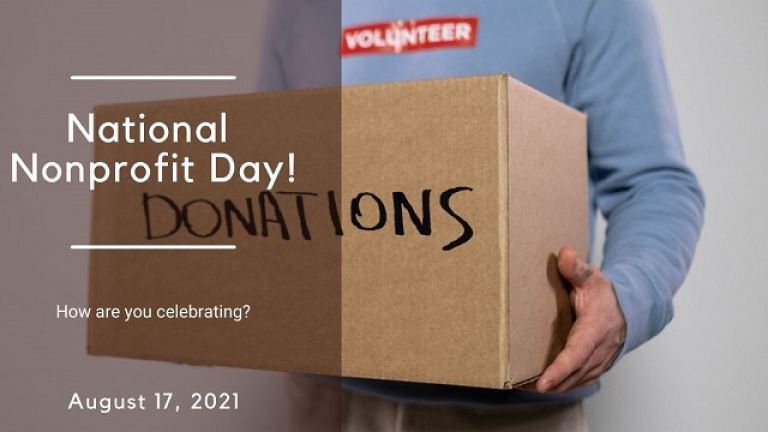 male volunteer holding donation box for national nonprofit day