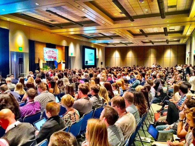 large indoor gathering at business conference